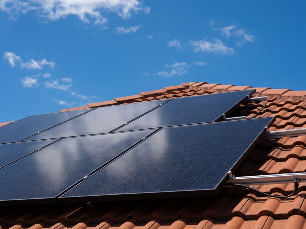 Finished rooftop solar panel array and inverter installed in Brisbane